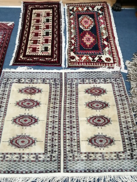 A Bokhara mat and two other Persian mats largest 128 x 94cm